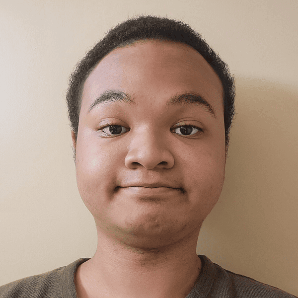 Young person with a neutral expression.